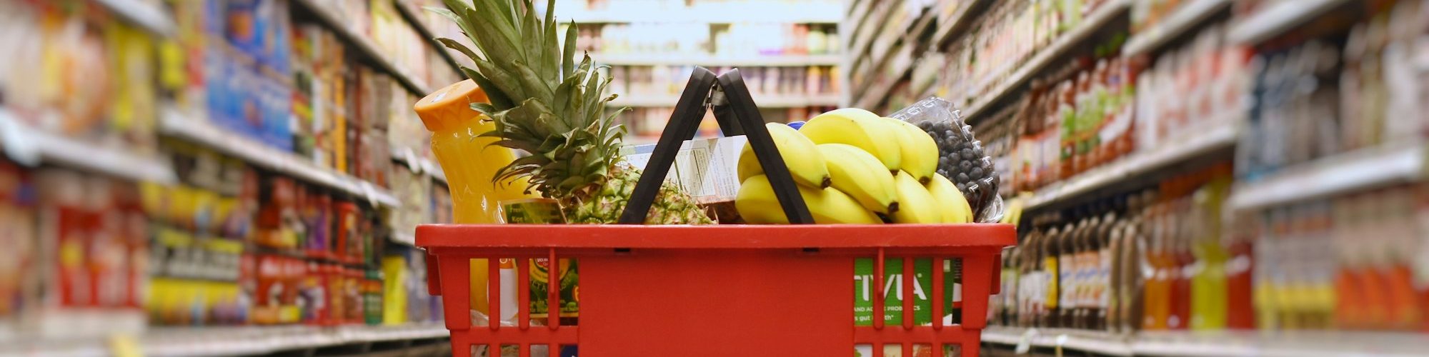 Basket with groceries in the supermarket